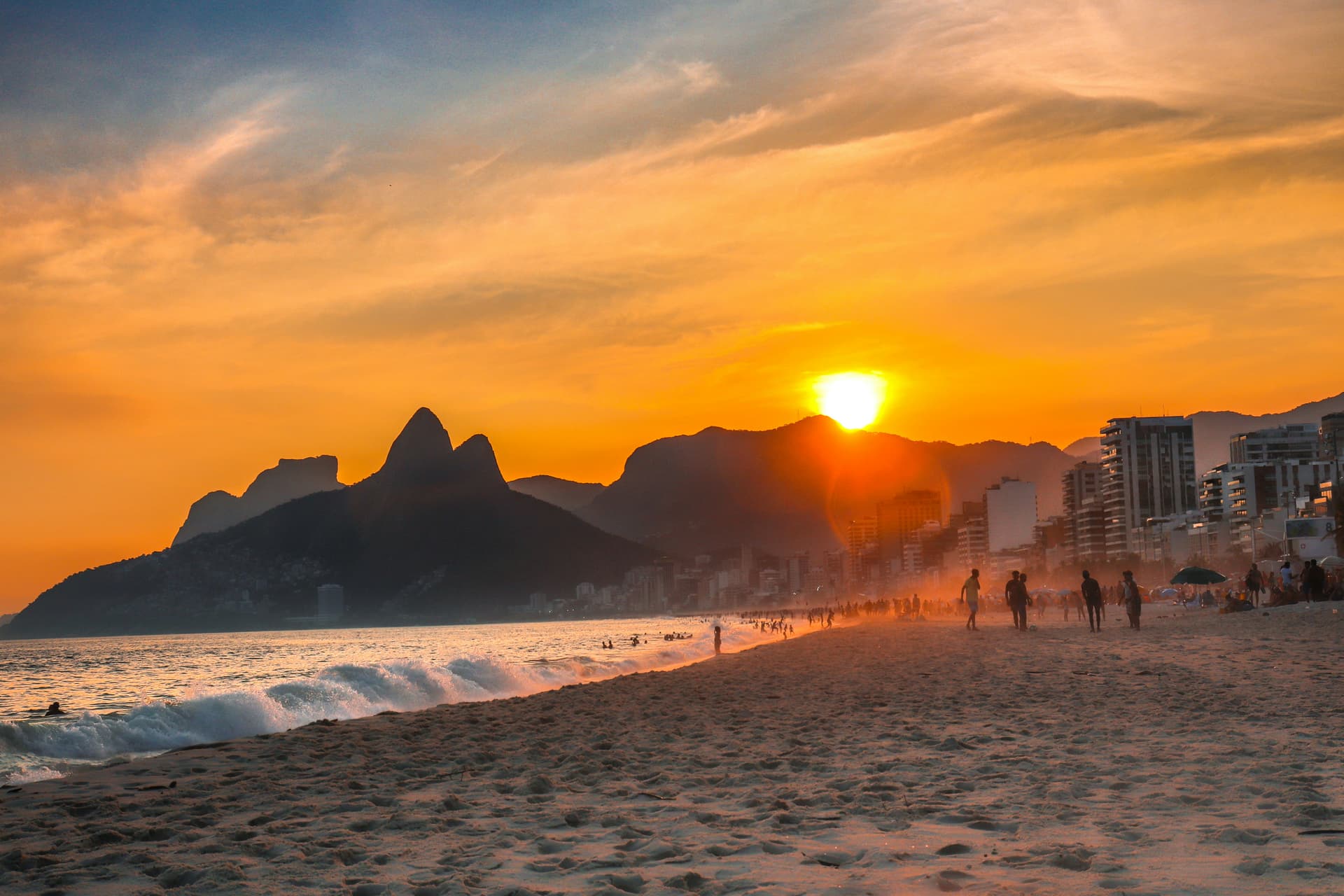 Sunset at Ipanema Beach with mountains in the background