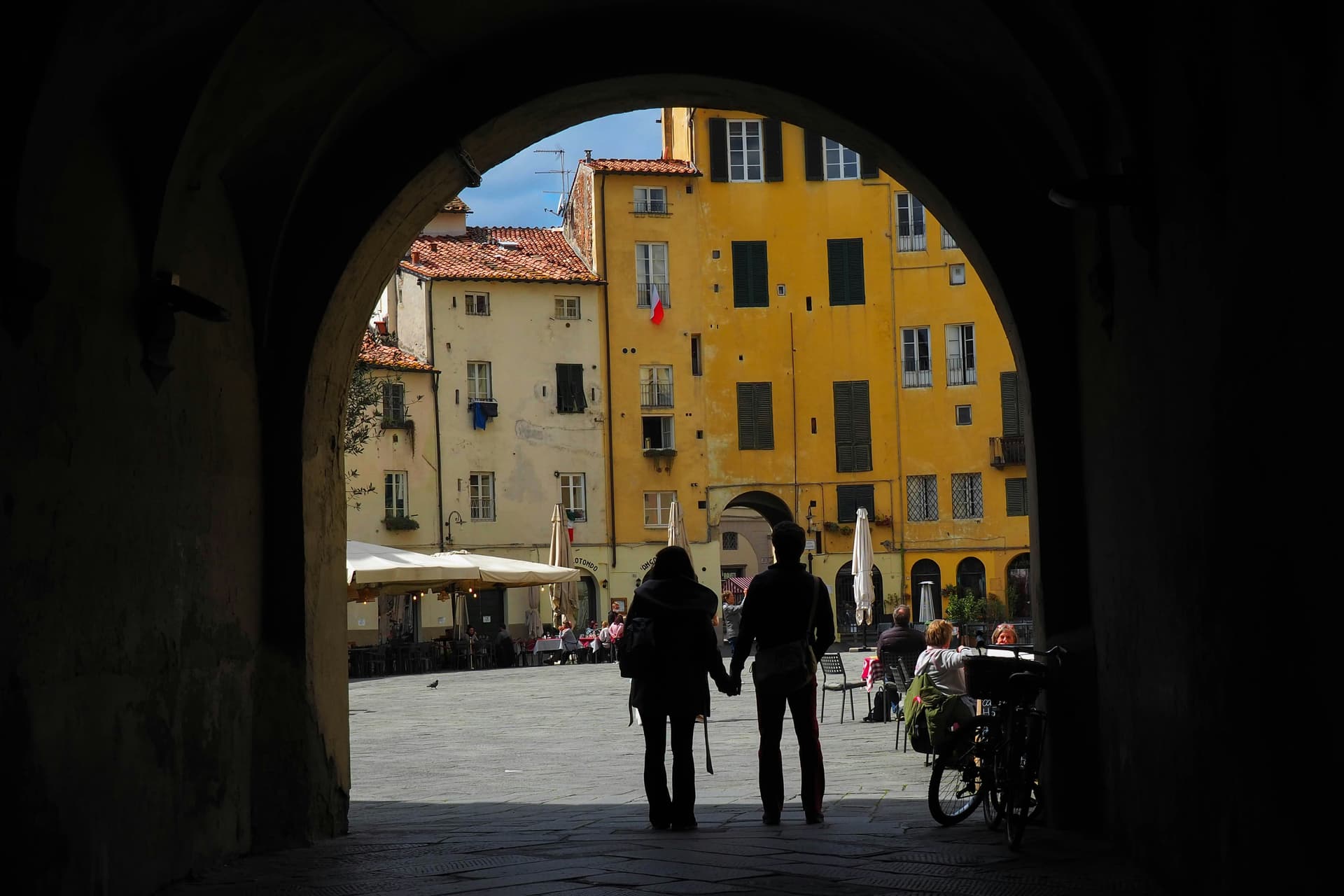 Couple embracing in Venice with sunset view in the background