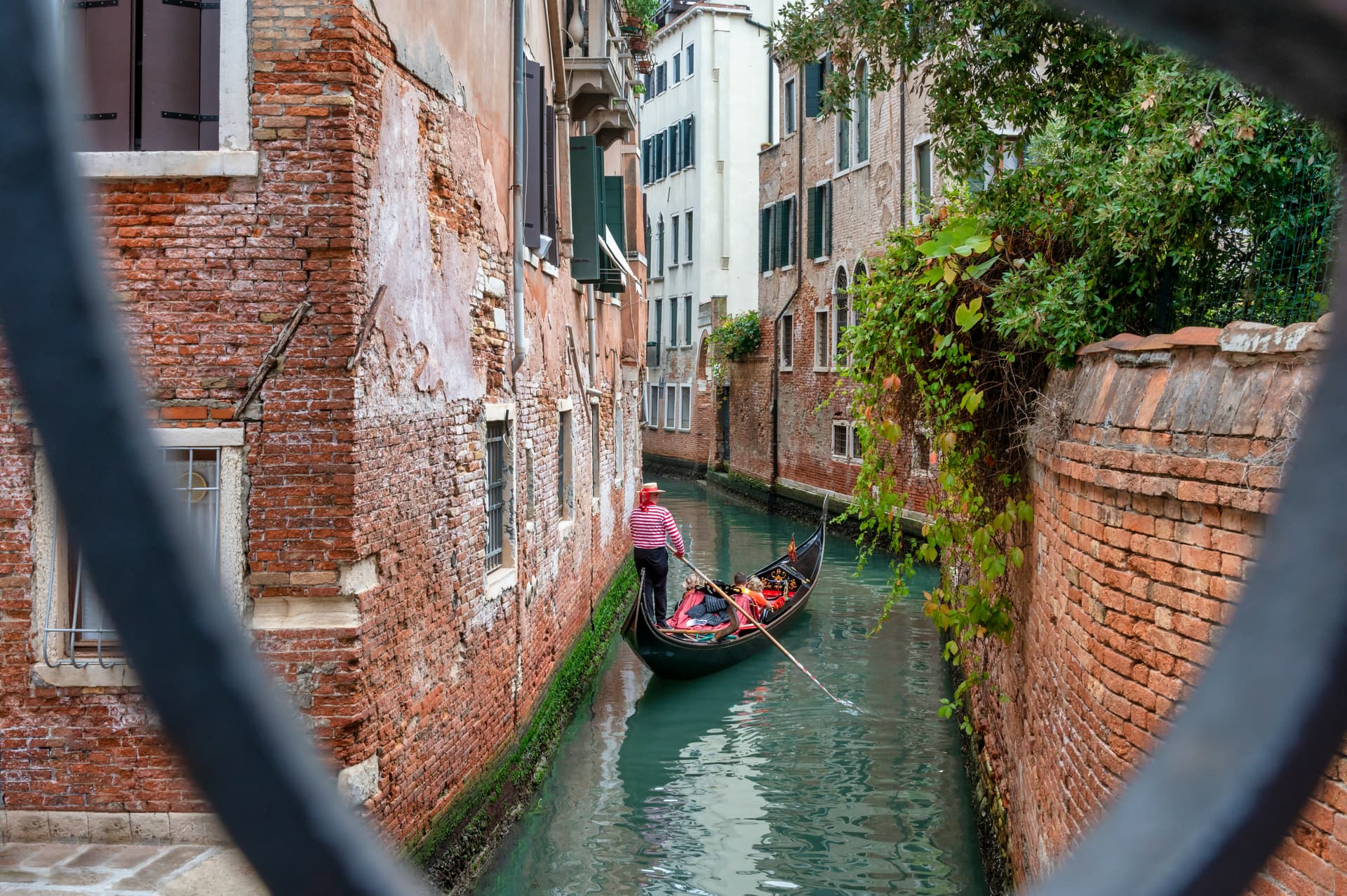 Couple enjoying a romantic gondola ride through the canals of Venice