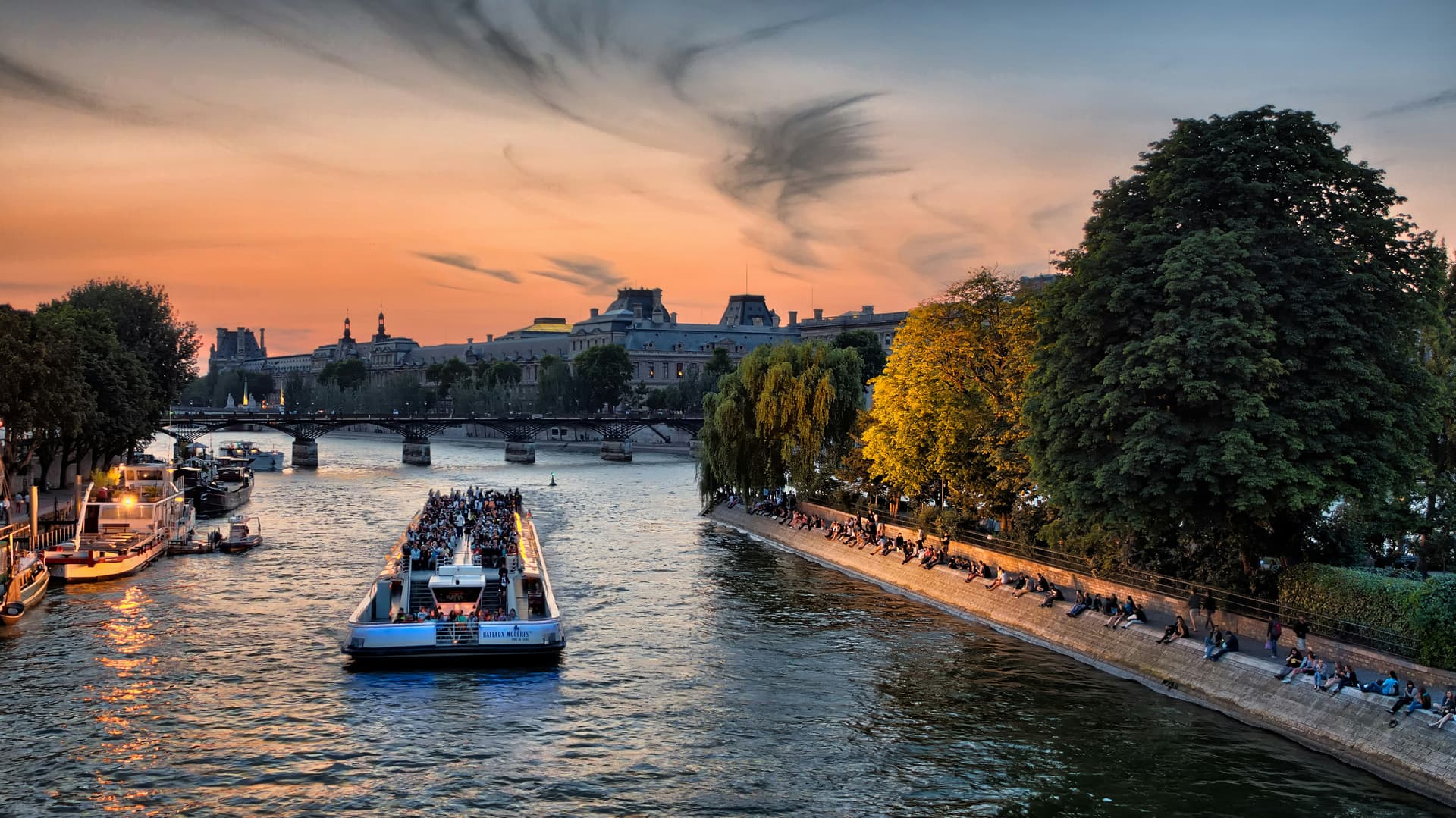 Seine River cruise in Paris at sunset with family on board