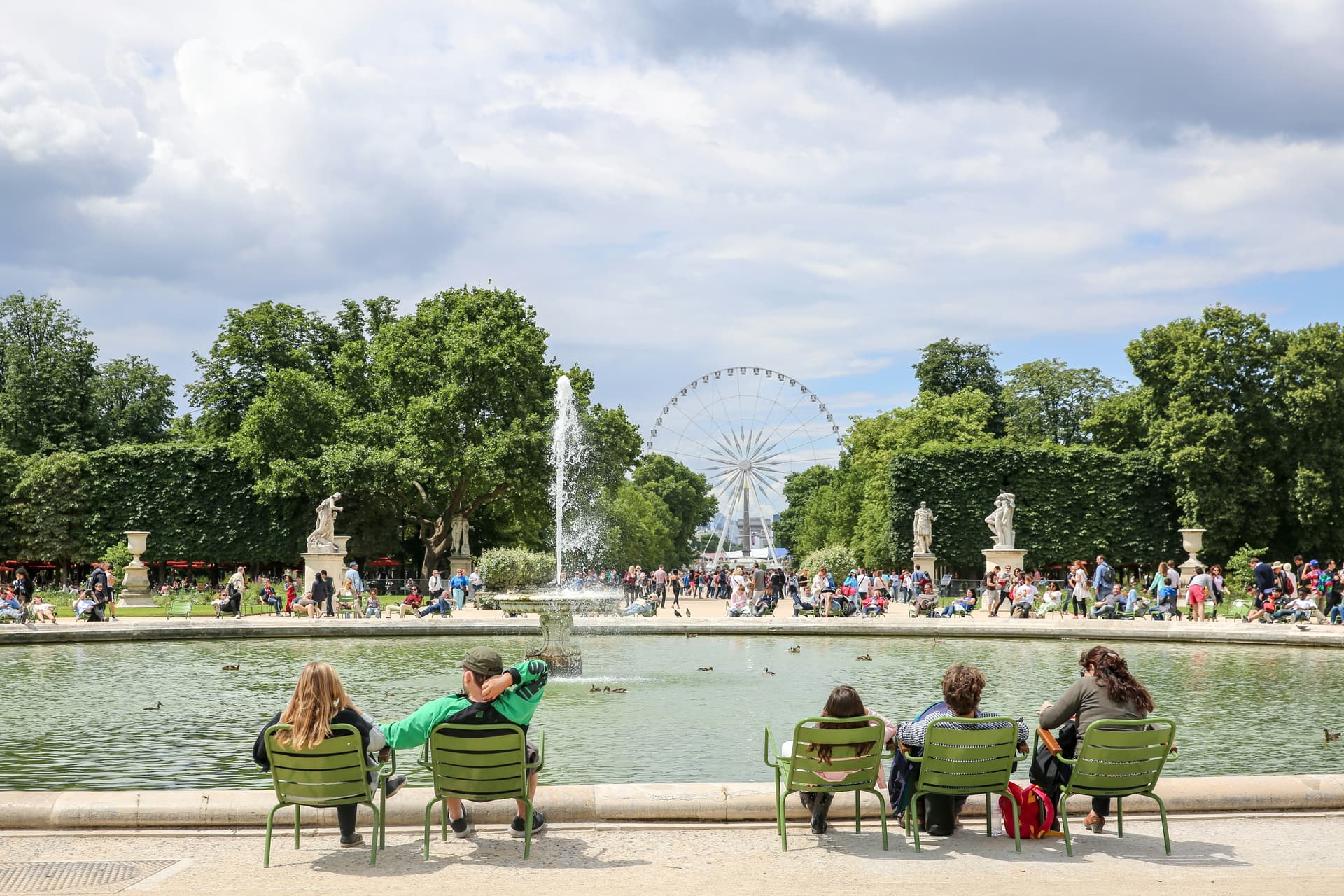 Jardin des Tuileries in Paris with children playing and green chairs